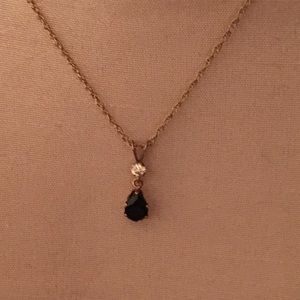 Gold necklace with diamond and blue stone